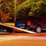 Tow truck helping a broken-down car