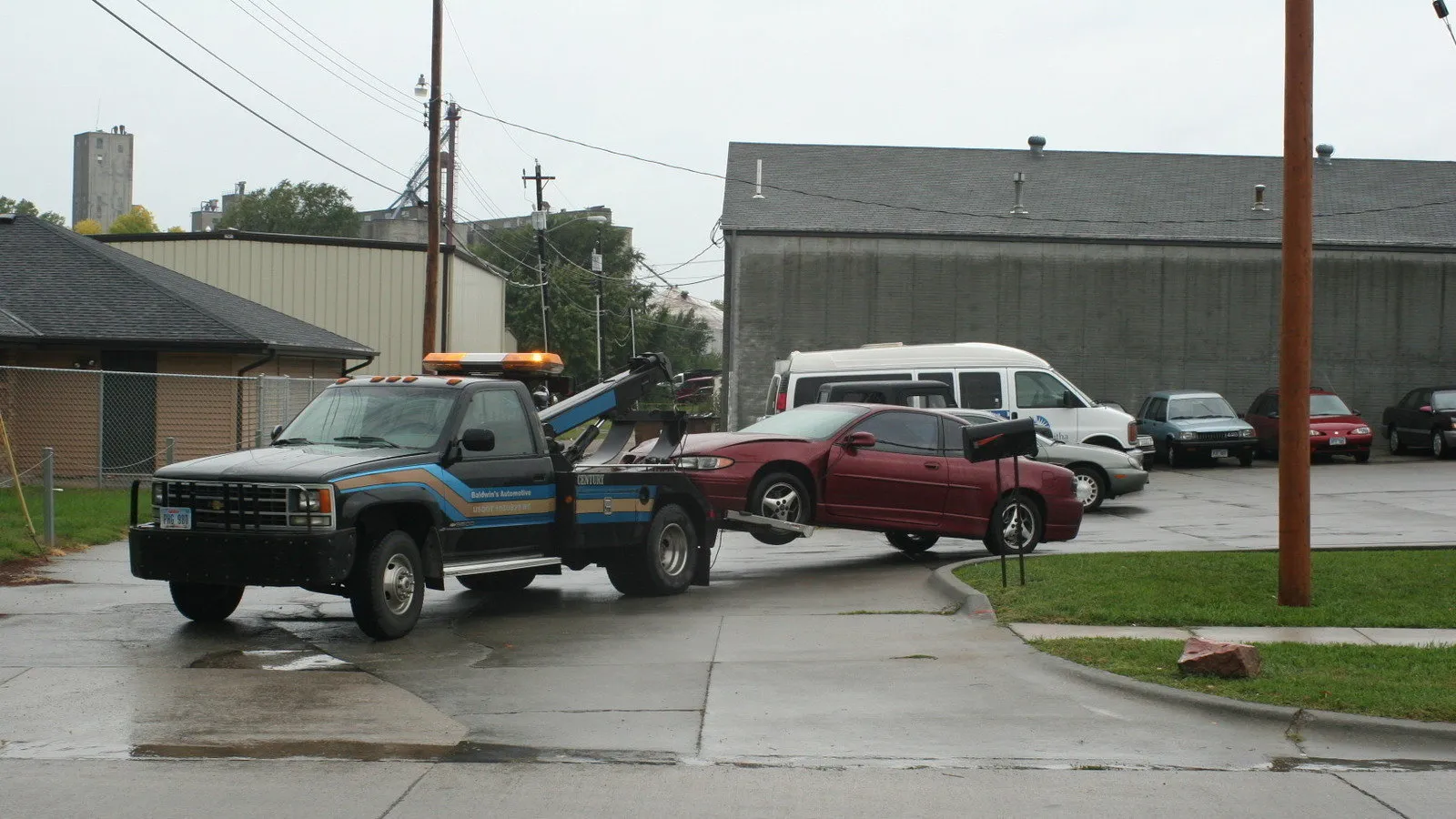 Tow truck towing a car from a parking lot — how to dispute a towing charge