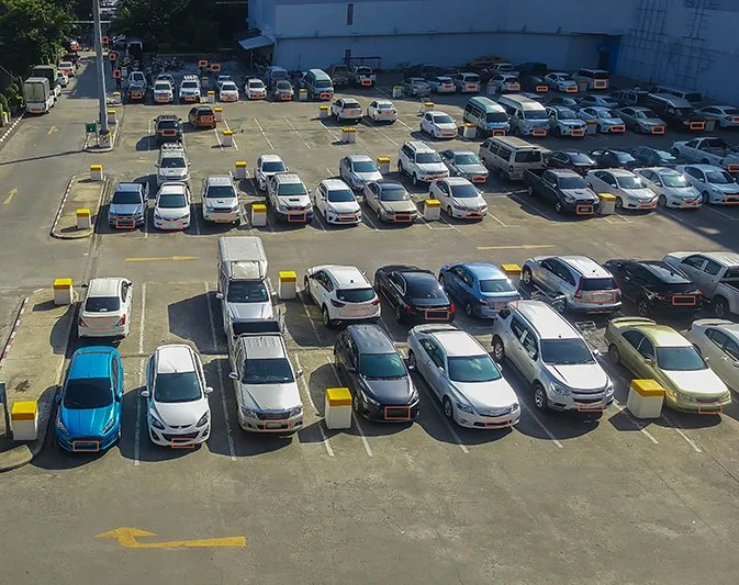 Cars stored at an impound lot with daily towing storage fees accumulating